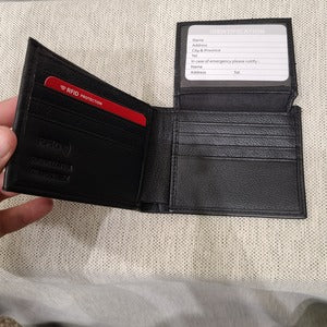 ID holder in the black flap wallet