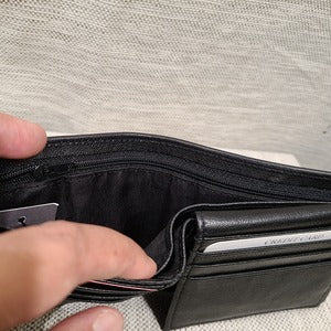 Clser view of bill compartment with zip closure