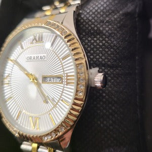 Side view of Dual tone wristwatch for men embellished with stones