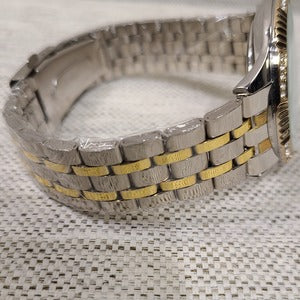 Detailed view of chain strap of dual tone wristwatch for men