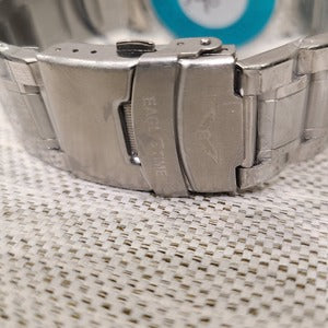 Clasp closure on silver men's watch when folded