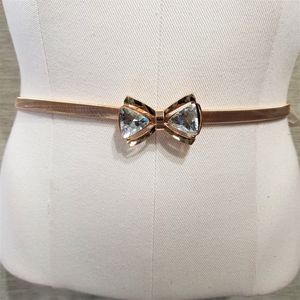 Stretchy gold belt with decorative buckle