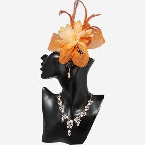 Orange fascinator adorned with net yarn and feathers