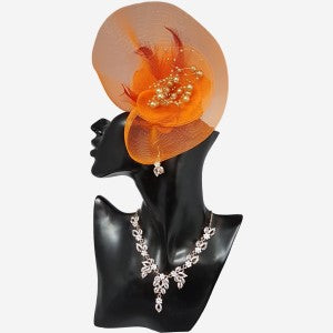Orange fascinator adorned with net yarn, pearls and feathers