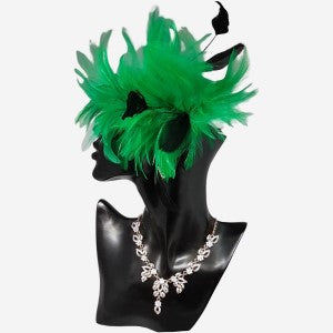 Fascinator with green and black feathers.