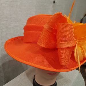 Bow detail of formal orange dress hat