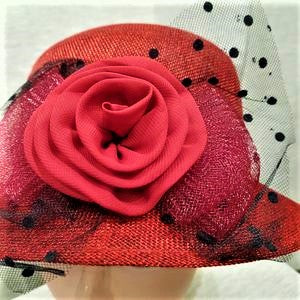 Detailing on red cloche hat 
