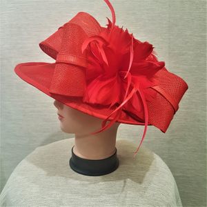 Bow and feather embellishment on red formal dress hat