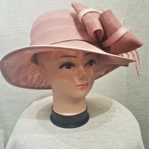 Formal dress hat in light pink with bow and feathers