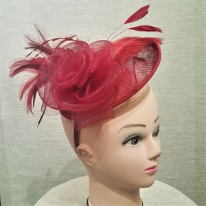 Burgundy cambric with feathers fascinator