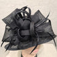 Bow and feather detail of Formal dress hat in black with mid size rim