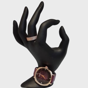 Wrist watch with purple leather strap and round face