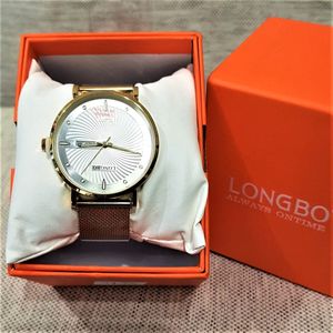 Wrist watch with gold color chain and magnetic closure