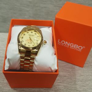 Round face wrist watch in gold with chain strap