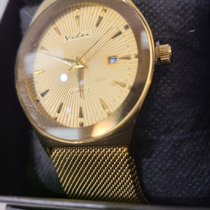 Detailed view of Gold round dial wristwatch with magnetic closure