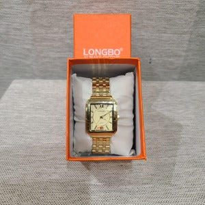 Rectangular face wristwatch with gold frame and inner dial