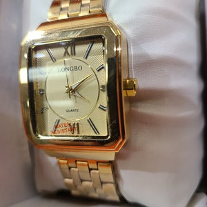 Side view of Rectangular face wristwatch with gold frame