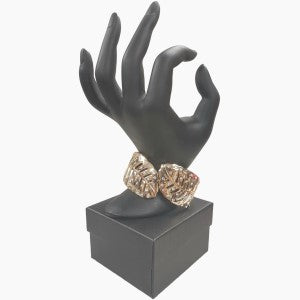 Gold bracelet with cut-out leaf pattern