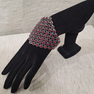 Stretchy bracelet adorned with red stones