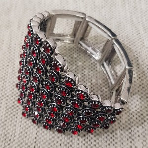 Detailed view of Stretchy bracelet adorned with red stones