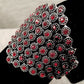 Closer view of red stones on stretchy bracelet
