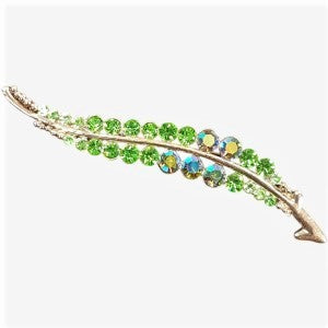 Leaf shaped brooch with green AB stones
