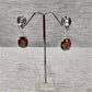 Dangle earrings with shaded oval stone