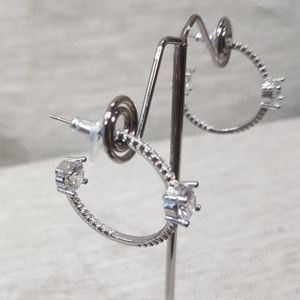 Modern open hoop earrings in silver color frame