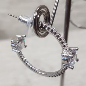 Detailed view of silver color frame open hoops