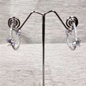 Front view of silver open hoop earrings with stones