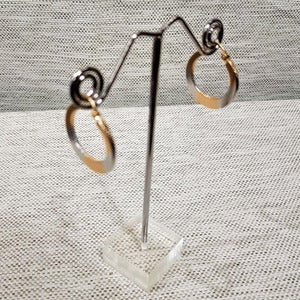Another view of Dual color medium size hoop earrings