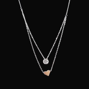 Layered necklace with heart and solitaire pendant pieces