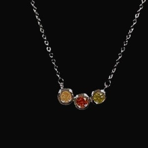 Necklace with tri color stones