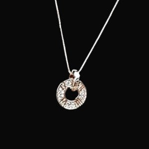 Gold frame necklace with donut pendant