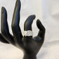 Detailed view of ring on mannequin hand