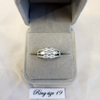 Silver color ring with center piece composed of oval stones
