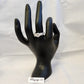 Solitare style ring with braided shank displayed on mannequin hand