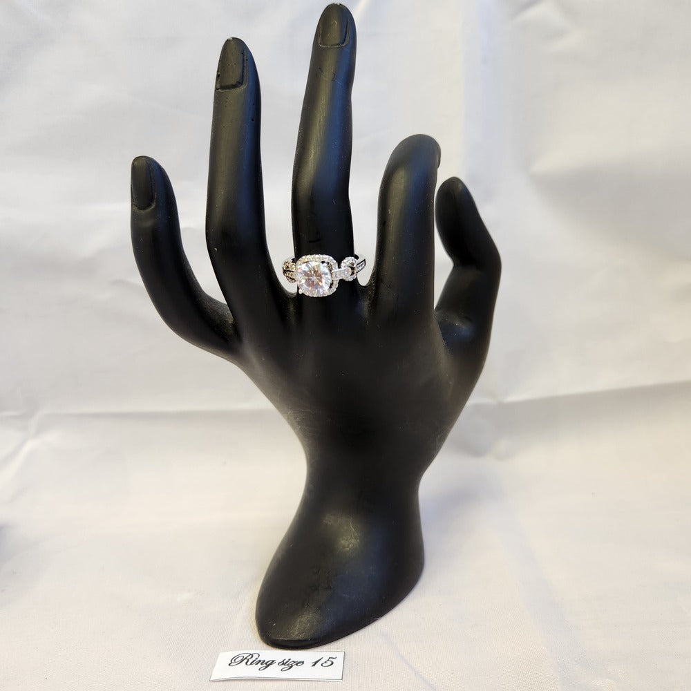 Square face stone studded ring on mannequin hand