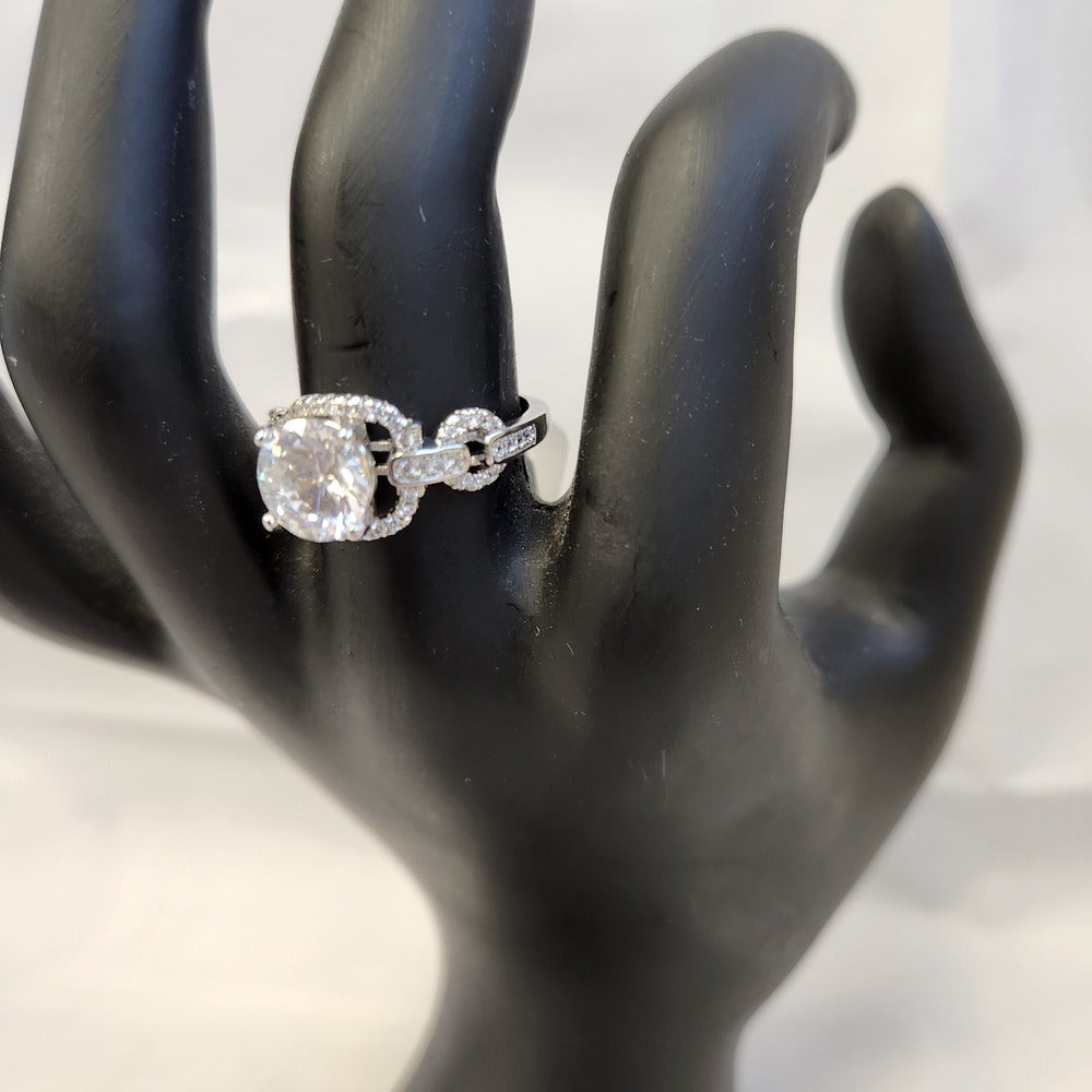 Detailed view of Square face ring on mannequin hand