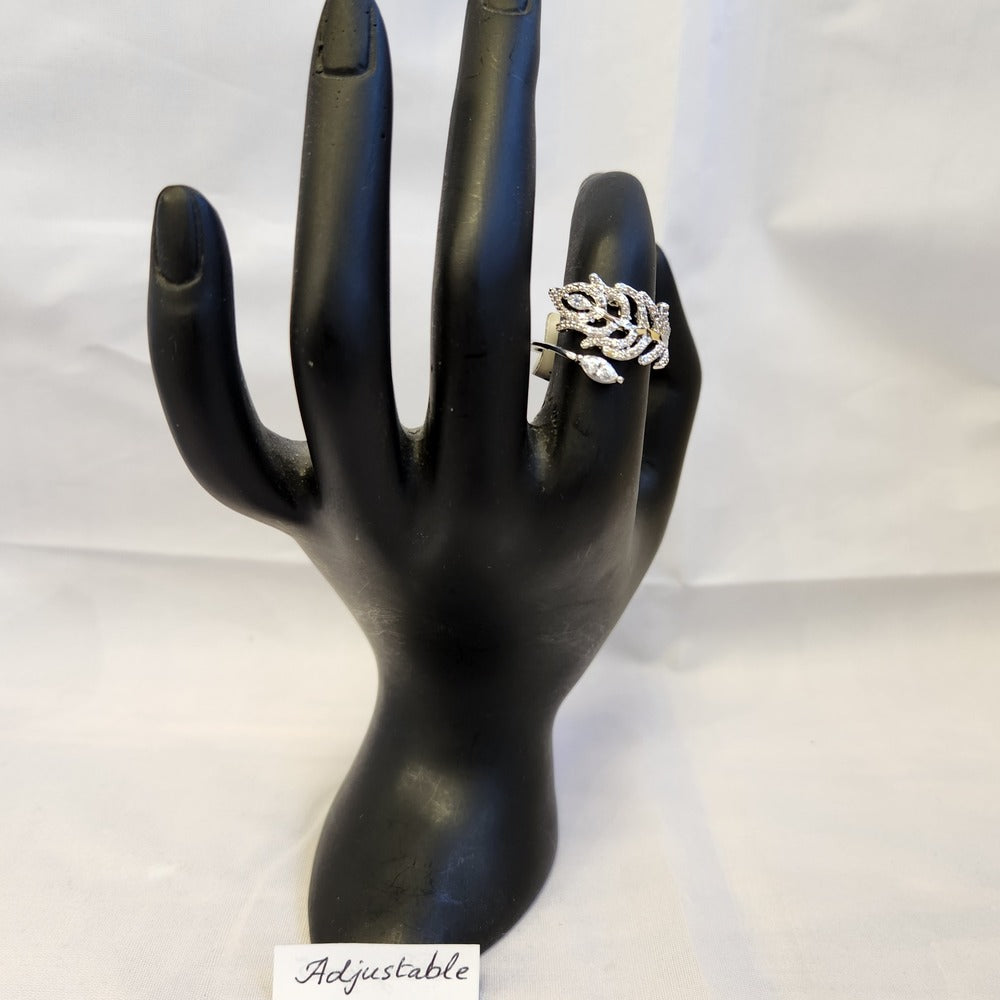 Feather shaped ring on a mannequin stand