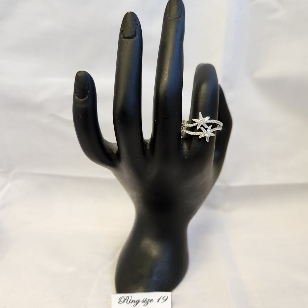 Stylish ring with star shaped center pieces displayed on a mannequin