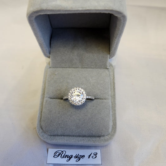 Stunning halo shaped ring with studded band