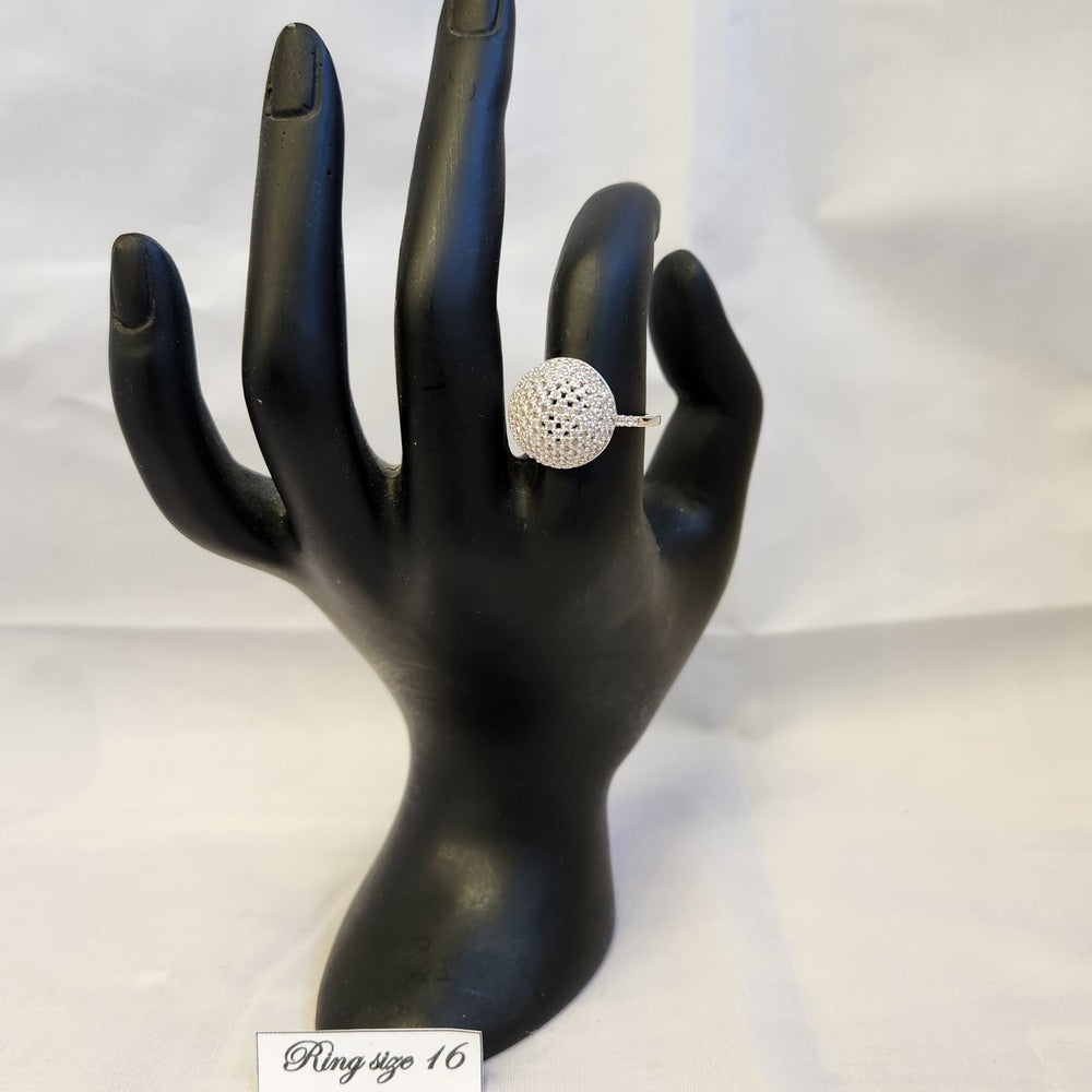 Hollow sphere stone studded ring displayed on a mannequin stand