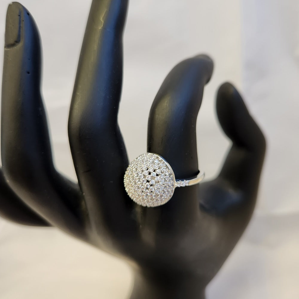 Closer look at the hollow sphere ring on a mannequin stand