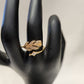 Alternative view of nature inspired gold frame ring on mannequin stand