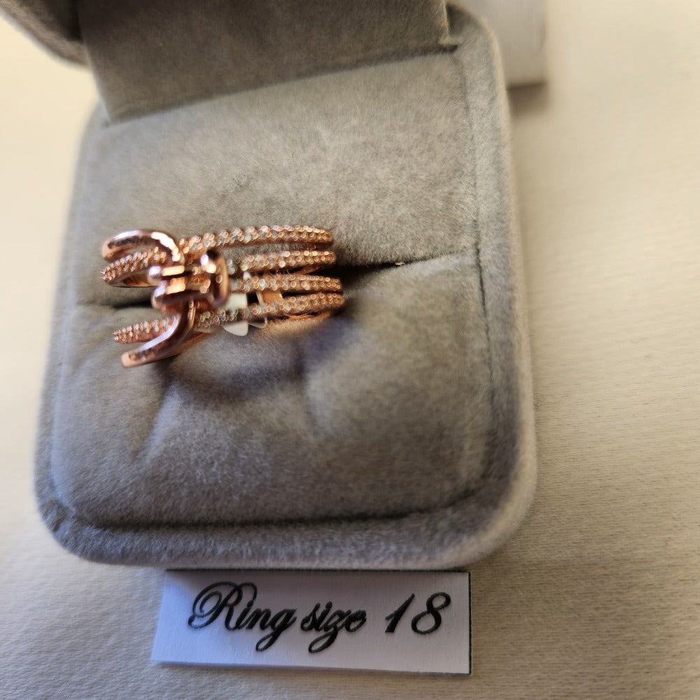 Detailed view of Multiple strand modern rose gold colored ring
