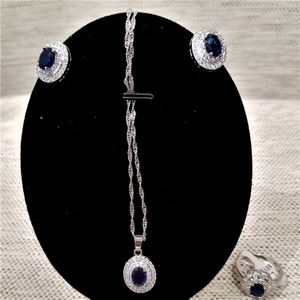 Another view of jewelry set with clear and blue stones