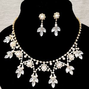 Three piece jewelry set with pearls and stones
