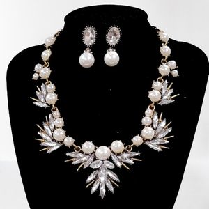 Three piece jewelry set with stones and pearl setting