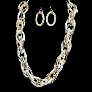 Three piece jewelry set in dull gold